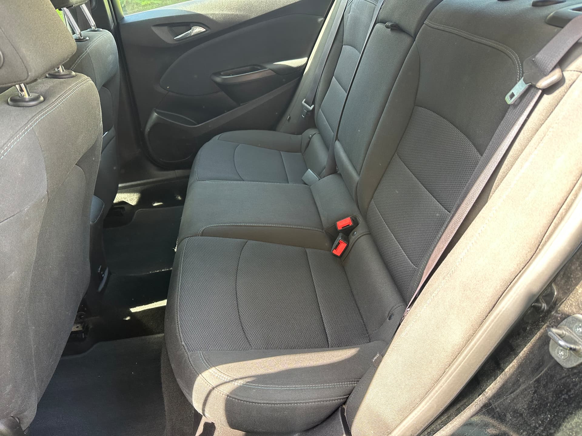 Shampooed rear seats of a black Chevrolet Cruze