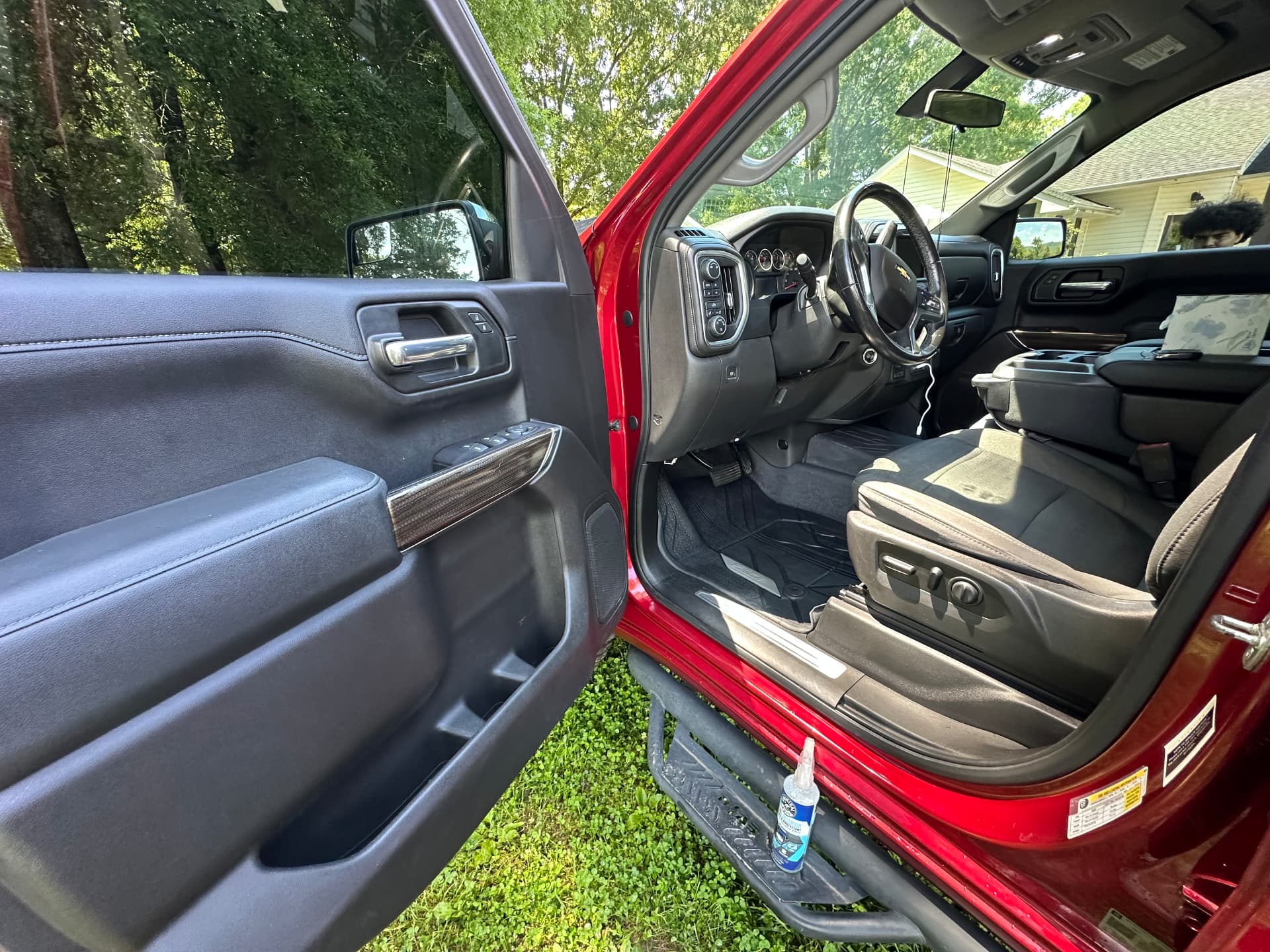 Spotless front interior and dash of a red Silverado