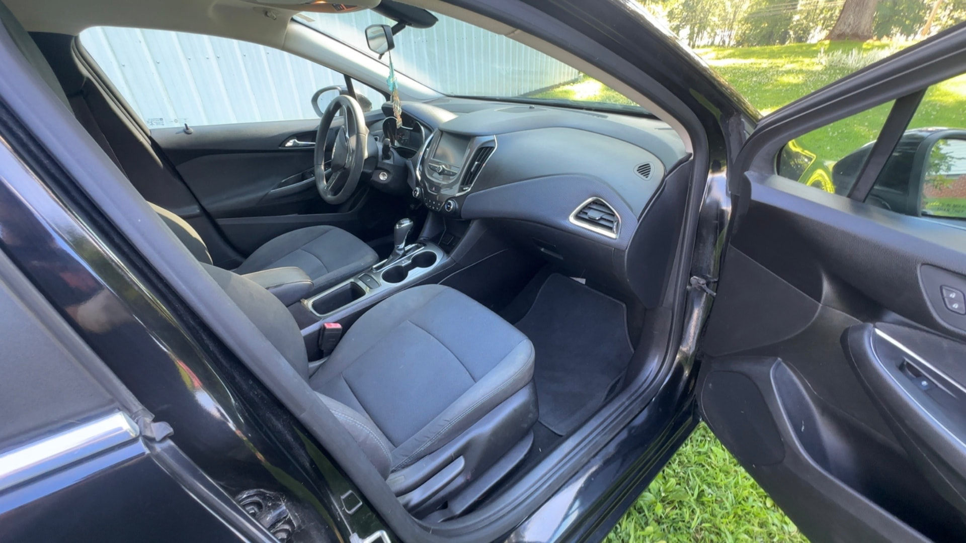 Detailed front interior of a black Chevrolet Cruze